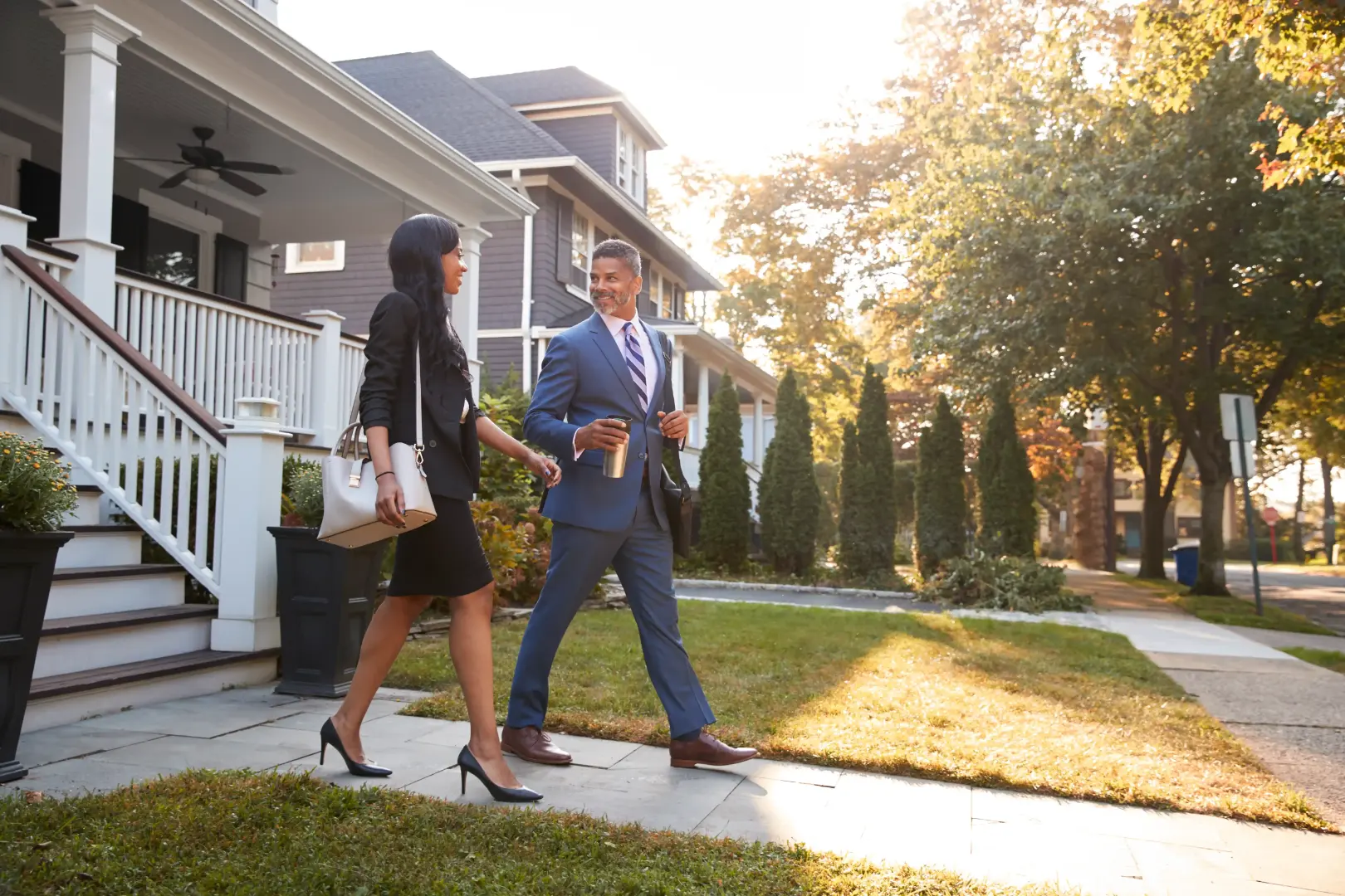 Professionals walking near a suburban property area